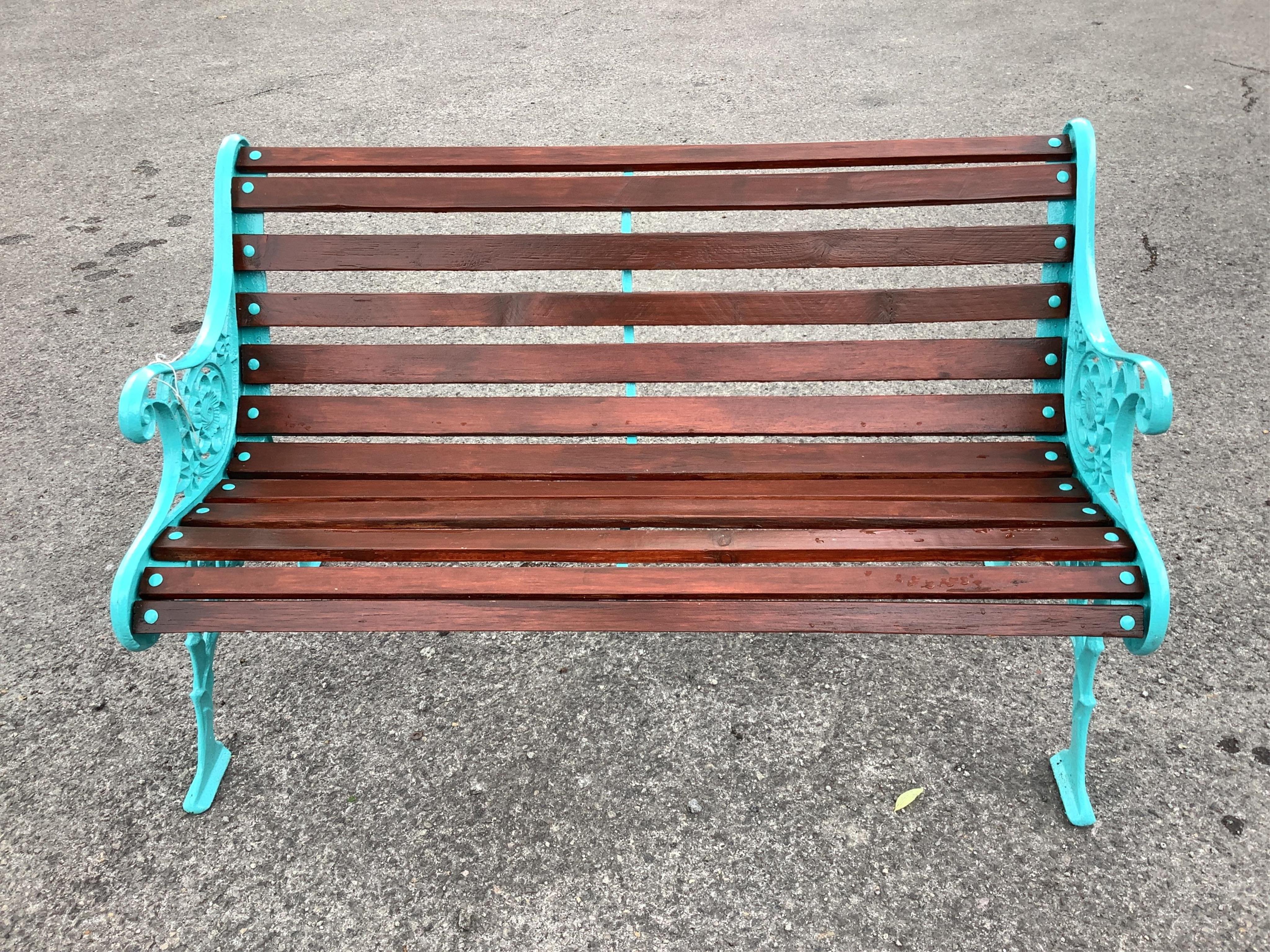 A Victorian style cast metal slatted wood garden bench, width 120cm, height 76cm